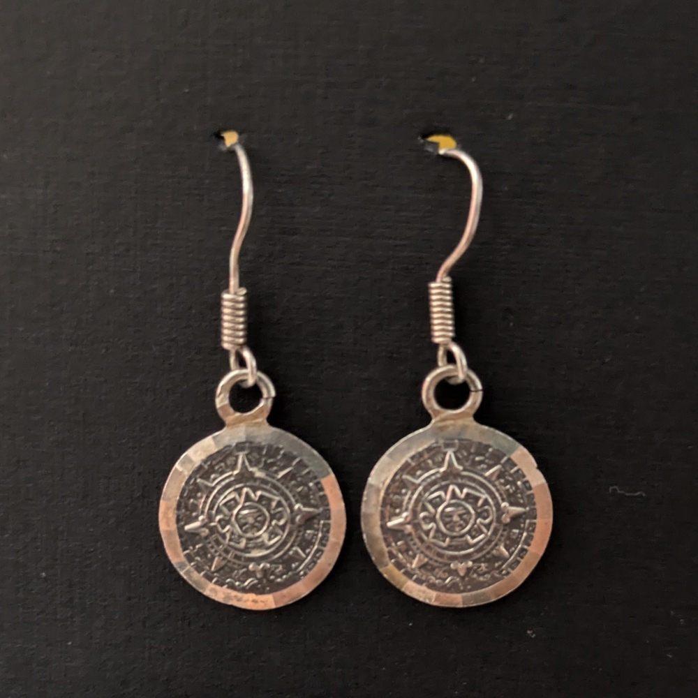 Silver Medallion Earrings with Intricate Design
